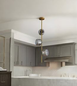 Modern kitchen with gray cabinets, pendant light, and white countertop.