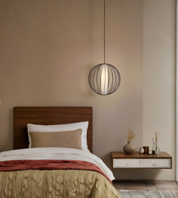 Bedroom with wooden headboard, nightstand, and pendant light.