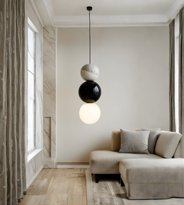 Modern living room with a stylish pendant light fixture.
