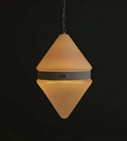 Triangular pendant light with a dark background