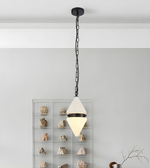 Modern pendant light hanging from the ceiling with a white shade and black chain.
