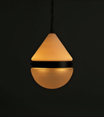 Pendant light with a conical shade on a black background