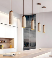 Modern kitchen interior with pendant lights hanging above a countertop.