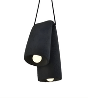 Black pendant light with a textured finish on a white background