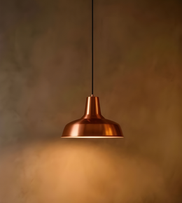 Copper pendant light against a textured brown background