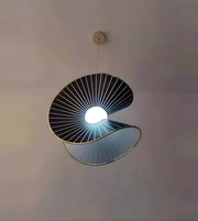 Modern pendant light with unique design on a neutral background