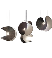 Modern pendant lights with unique designs on a white background