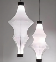 Two modern pendant lights with unique geometric designs on a gray background