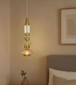 Modern pendant light fixture in a room with a neutral color scheme.