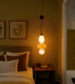 Aurora Trio glass pendant light by Daya Worldwide hanging in a modern living space, featuring clear glass shades and sleek design.