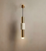 Pendant light with gold and white design on a neutral background