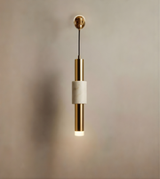 Pendant light with gold and white design on a neutral background