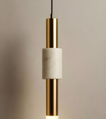 Pendant light with gold and white design on a neutral background