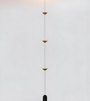 Modern pendant light with geometric design on a neutral background