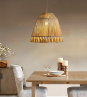 Dining room with a wooden table, chairs, and a hanging lamp.