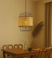 Dining room with a wicker pendant light, wooden table, and chairs.