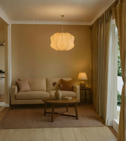 Living room with beige sofa, wooden coffee table, and pendant light.
