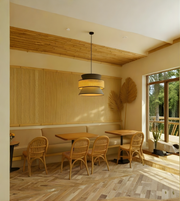 Modern interior of a restaurant with wooden tables, chairs, and a large window.