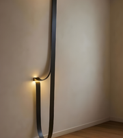 Modern wall light fixture on a plain wall