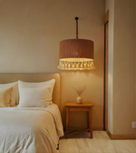 Bedroom with a wooden nightstand and hanging lamp