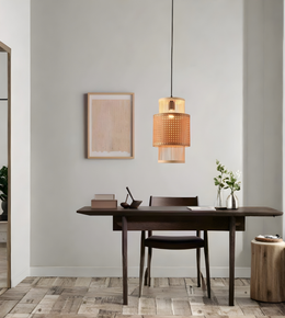 Modern dining room with wooden table, chairs, and pendant light fixture.
