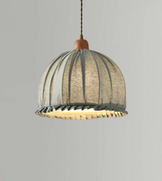 Pendant light with woven design on a gray background