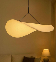 Modern pendant light hanging in a room with a warm glow
