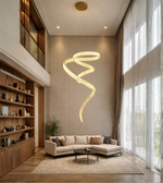 Modern spiral LED chandelier installed in a luxury double height living room with contemporary interior