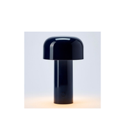 Close-up of glossy black dome shade table lamp