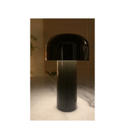 Minimalist black table lamp on marble surface
