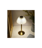 Slim gold desk lamp with warm ambient lighting