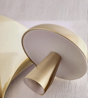 Close-up of brushed gold dome shade table lamp