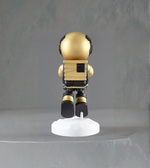 Gold astronaut figurine lamp holding glowing moon orb