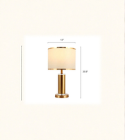 Close-up of fabric lampshade with gold rim detailing