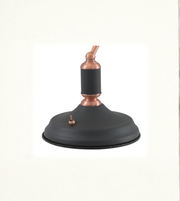 Close-up of black metal shade with copper detailing on banker lamp