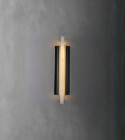 Contemporary linear wall light emitting warm ambient glow on textured wall