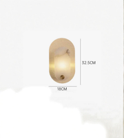 Modern oval wall lamp with warm ambient lighting and compact dimensions