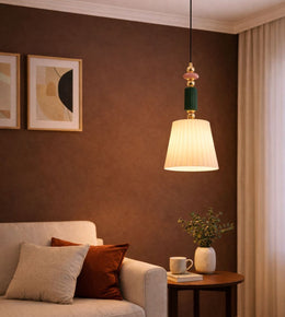 Elegant hanging lamp with warm glow above side table and sofa