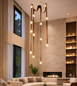 luxury cascading chandelier with leather straps and glowing rings in double height living room, modern statement lighting