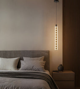 modern vertical pendant light with grid design hanging beside bed, warm ambient lighting for contemporary bedroom