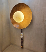 Decorative textured wall lamp with illuminated center globe