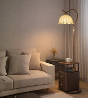 Vintage wooden floor lamp with built-in shelf and fabric shade beside sofa creating warm ambient lighting in cozy living room