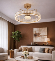 Luxury crystal ring fandelier with gold finish combining ceiling fan and chandelier in modern living room interior