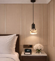 mini marble pendant light with black top hanging beside bed, warm ambient lighting for modern bedroom