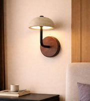 modern stone dome wall light with wooden base mounted beside bed, warm ambient lighting for cozy bedroom