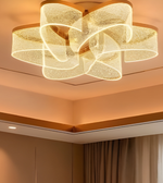 Modern ceiling light fixture with a warm glow on a ceiling