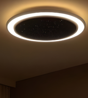 Ceiling light fixture with a starry sky design on a ceiling
