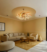Warm contemporary living room featuring floral glass ceiling chandelier with golden ambient lighting
