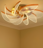 Modern petal-shaped glass ceiling chandelier with gold base and textured glass panels