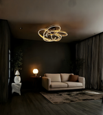 Modern living room with a ceiling light fixture, sofa, and side table.